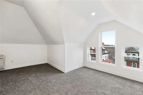 an empty room with staircase