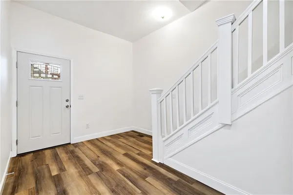 a view of a hallway with staircase