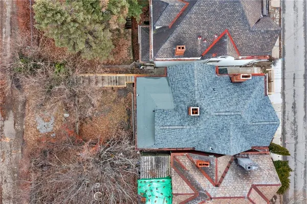 an aerial view of residential houses with outdoor space