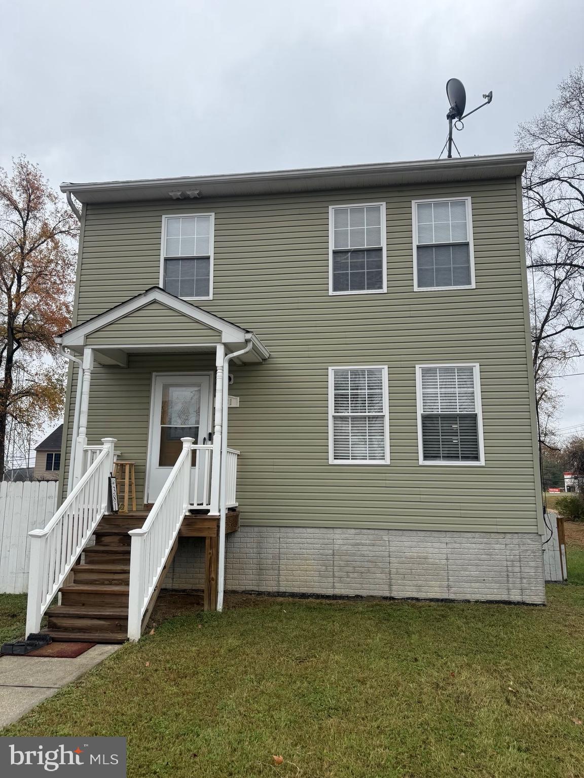 381 Baltimore Avenue Odenton, MD 21113 - Photo 1 of 1 a view of a house with wooden fence and a stairs