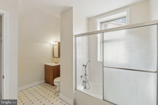 a bathroom with a shower and toilet