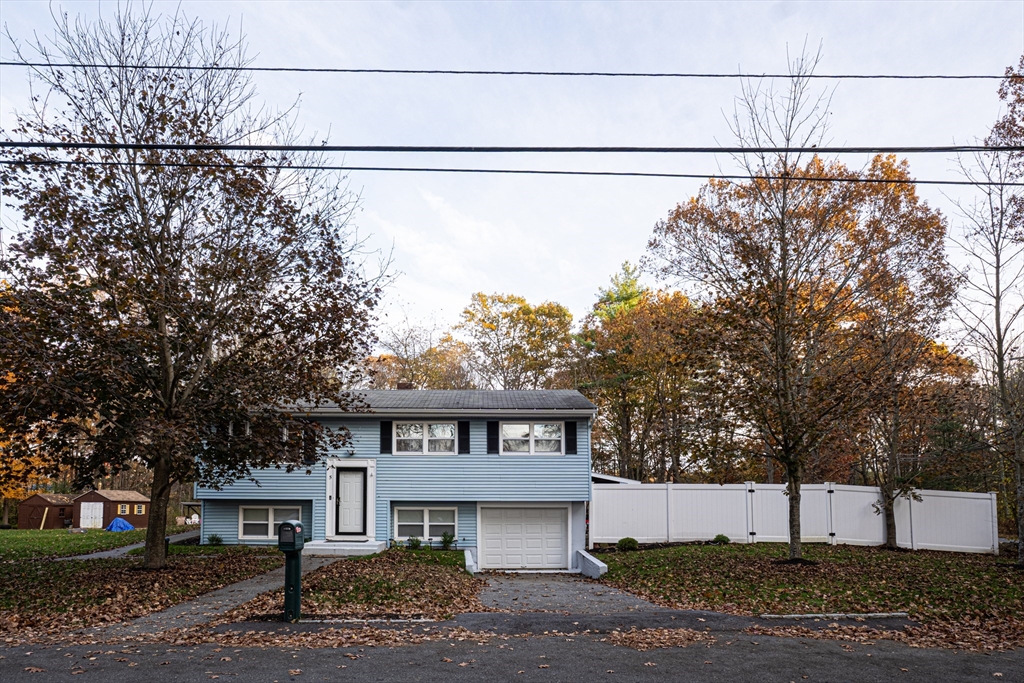 a view of a house with a street