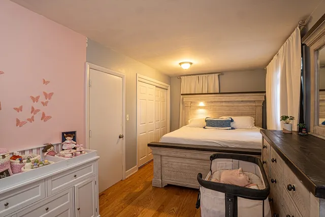 a bedroom with a bed and a dresser