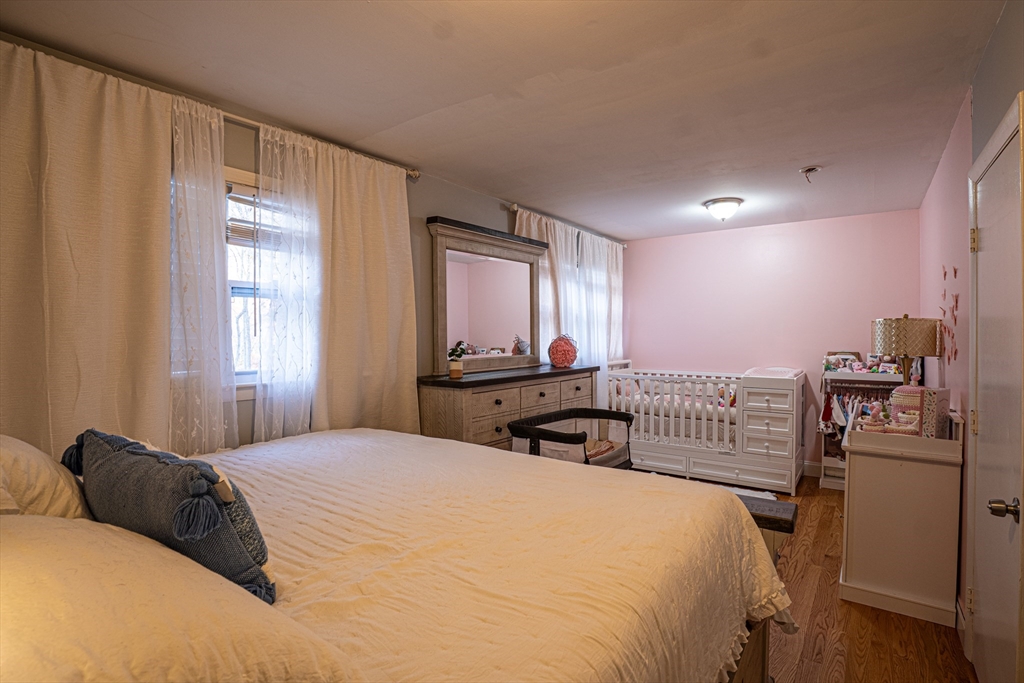 5 Bailey Road Dracut, MA 01826 - Photo 14 of 26 a bedroom with a bed and a window