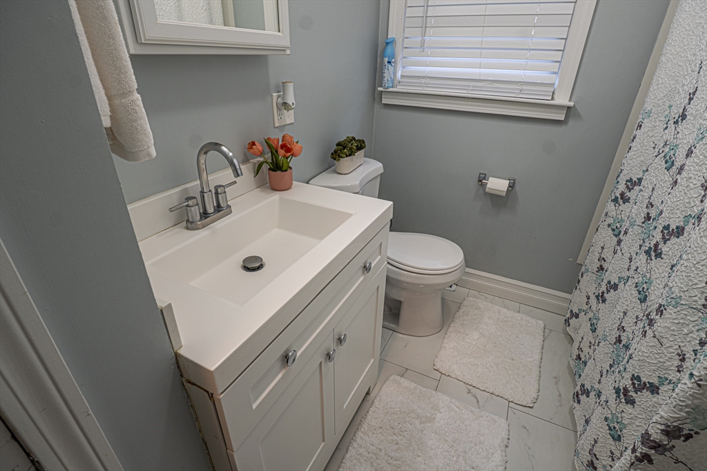 5 Bailey Road Dracut, MA 01826 - Photo 16 of 26 a white sink sitting next to a white toilet