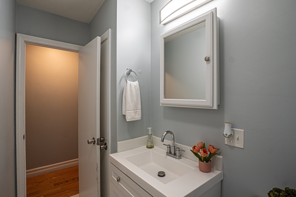 5 Bailey Road Dracut, MA 01826 - Photo 17 of 26 a bathroom with a sink and a mirror