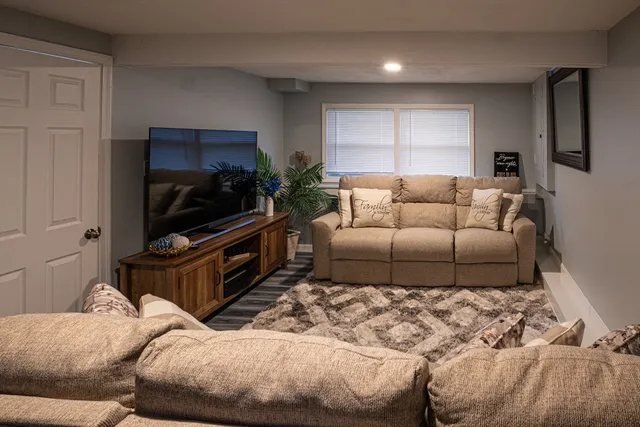 a living room with a couch and a flat screen tv