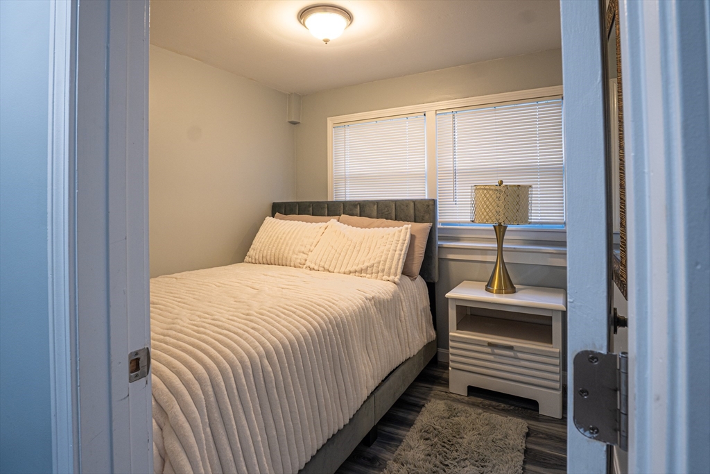 5 Bailey Road Dracut, MA 01826 - Photo 20 of 26 a bedroom with a bed and a window