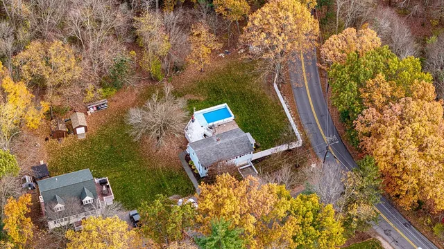 an aerial view of house with yard