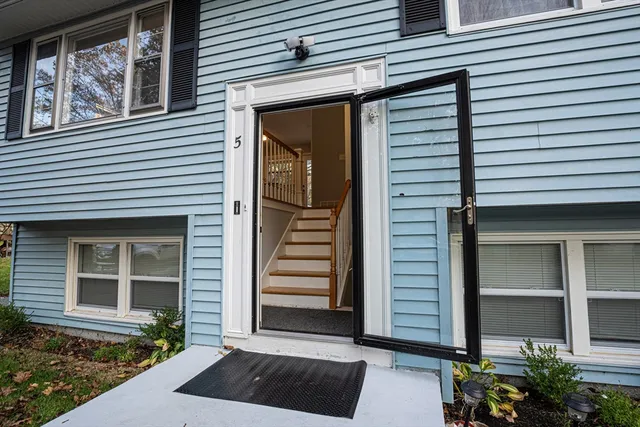 a view of a house with a door and a window