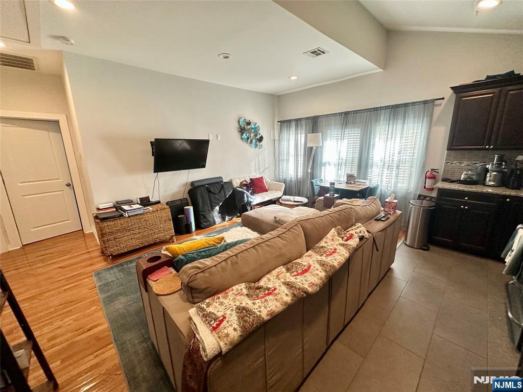 390-apt 4 Orange Road, Unit 4 Montclair, NJ 07042 - Photo 5 of 12 a living room with furniture and a flat screen tv