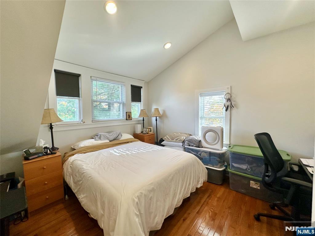 390-apt 4 Orange Road, Unit 4 Montclair, NJ 07042 - Photo 6 of 12 a bedroom with bed a chair and a large window