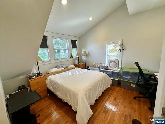 a bed room with a bed and a window