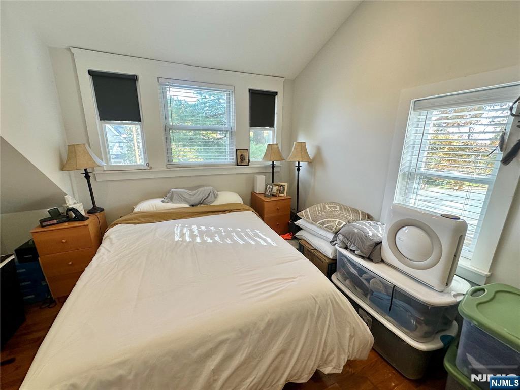 390-apt 4 Orange Road, Unit 4 Montclair, NJ 07042 - Photo 8 of 12 a bedroom with a bed and window