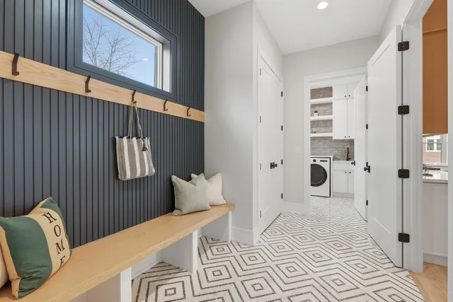 a bedroom with a bed and a mirror