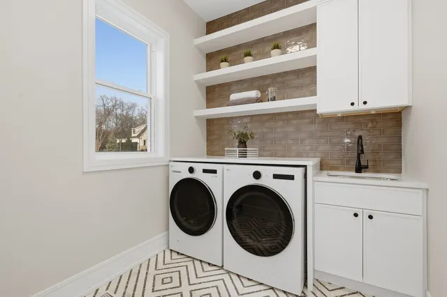a utility room with dryer and washer