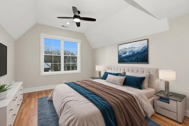 a bedroom with a large bed and a window