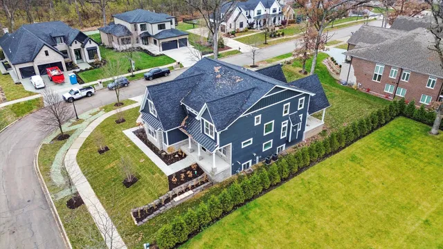 an aerial view of a house with a swimming pool