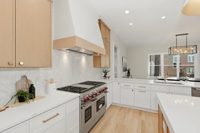 a kitchen with a stove a sink and a refrigerator