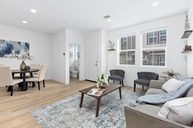 a living room with furniture and a rug