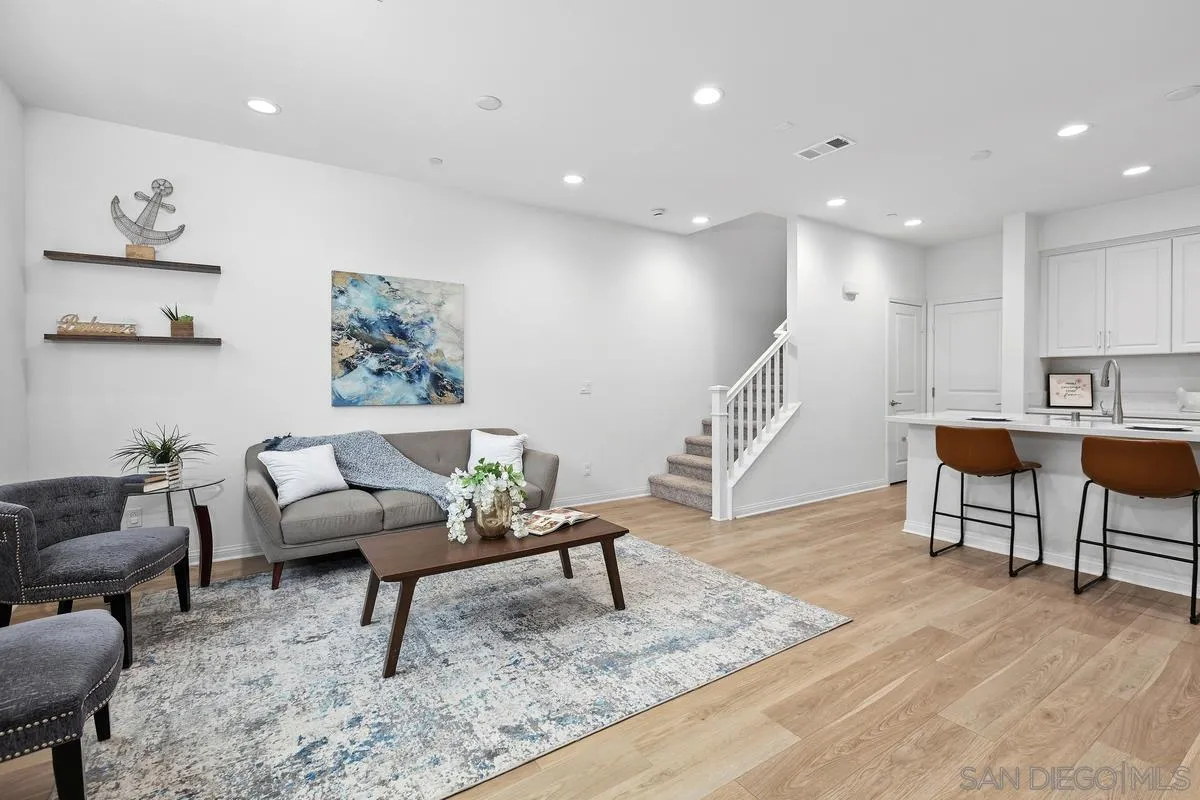 10149 Graphite Street Spring Valley, CA 91977 - Photo 13 of 35 a living room with furniture and a rug