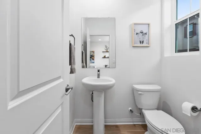 a bedroom with bed and a chair