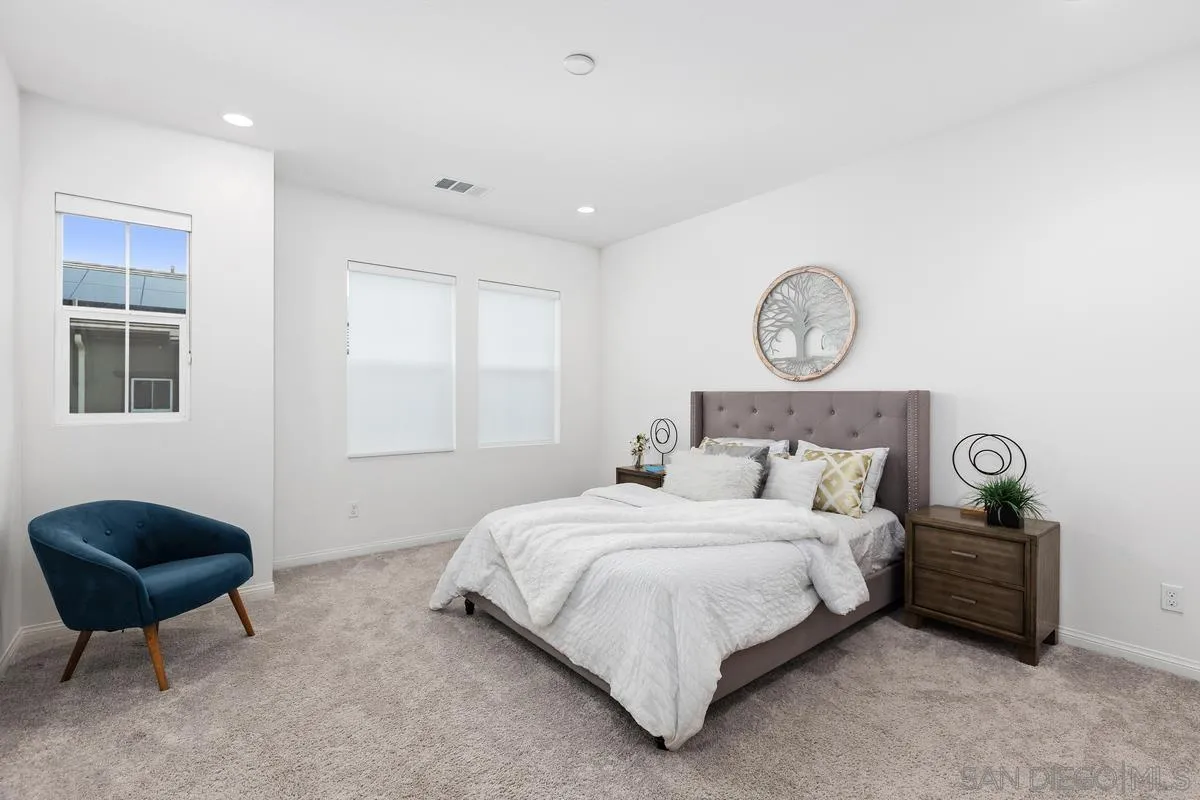 10149 Graphite Street Spring Valley, CA 91977 - Photo 15 of 35 a bedroom with bed and a chair