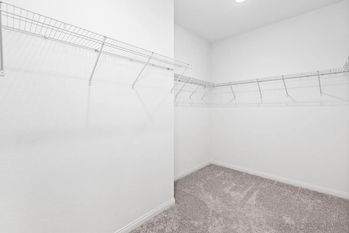 10149 Graphite Street Spring Valley, CA 91977 - Photo 18 of 35 a view of a room with racks on the wall