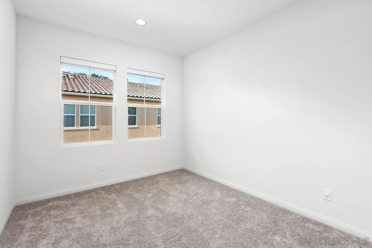 10149 Graphite Street Spring Valley, CA 91977 - Photo 21 of 35 a view of an empty room with a window