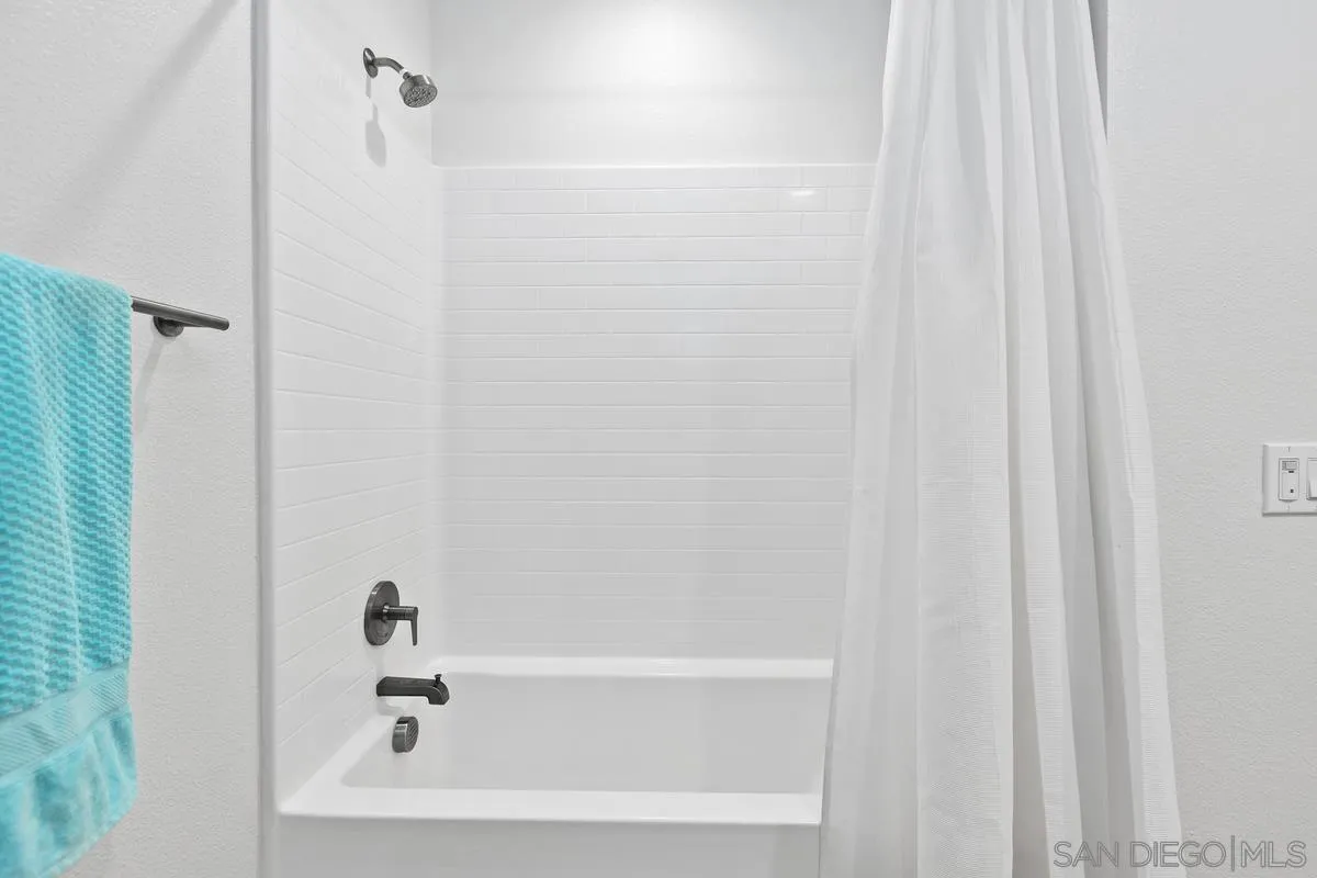 10149 Graphite Street Spring Valley, CA 91977 - Photo 23 of 35 a bathroom with a bathtub