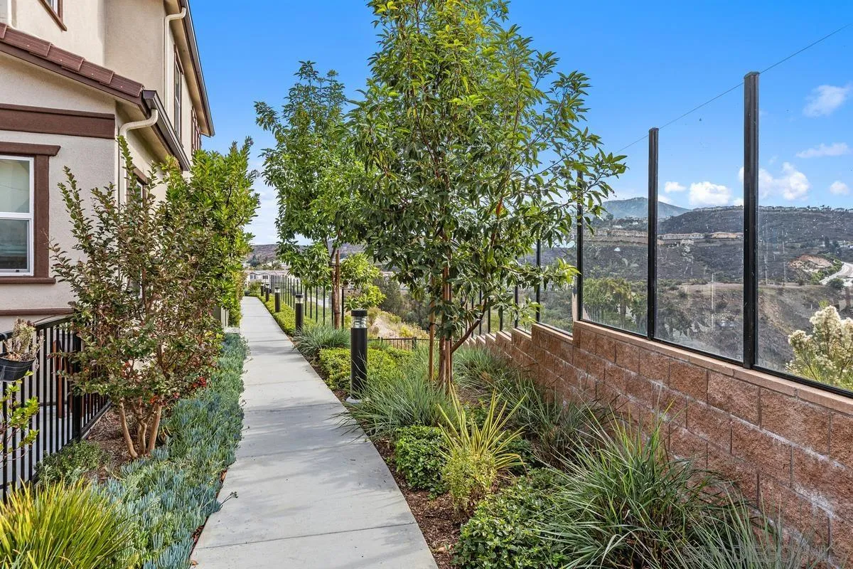 10149 Graphite Street Spring Valley, CA 91977 - Photo 24 of 35 a view of a pathway with a tree in front of it