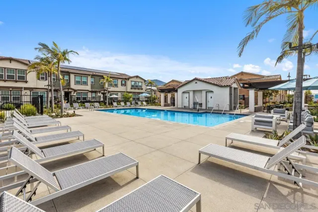 a view of a dining table and chairs in the patio