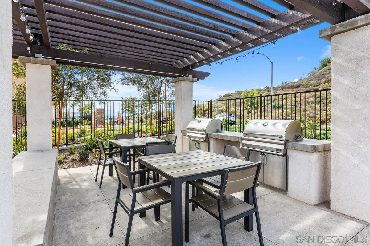 10149 Graphite Street Spring Valley, CA 91977 - Photo 30 of 35 a view of a dining table and chairs in the patio
