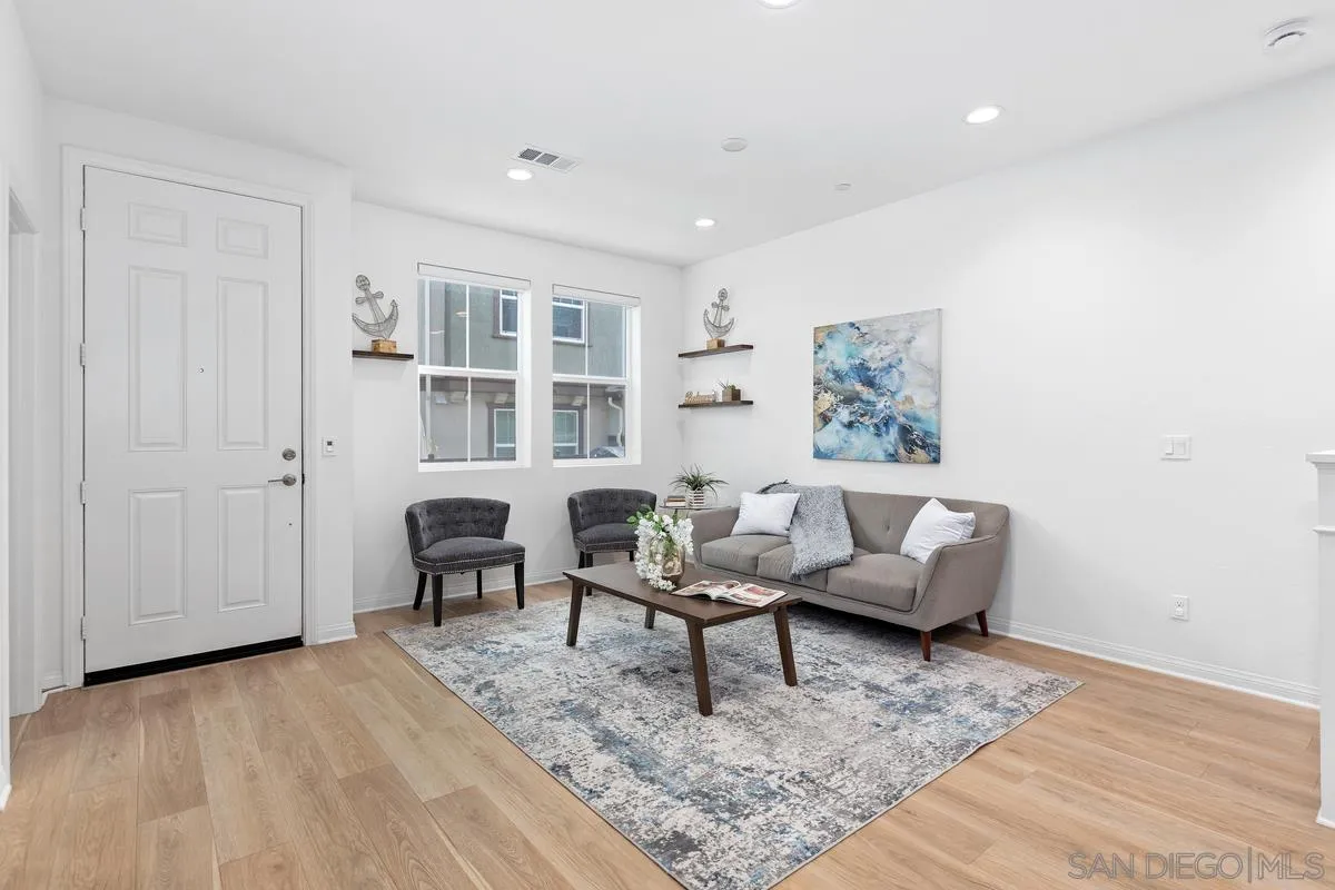 10149 Graphite Street Spring Valley, CA 91977 - Photo 6 of 35 a living room with furniture and a wooden floor
