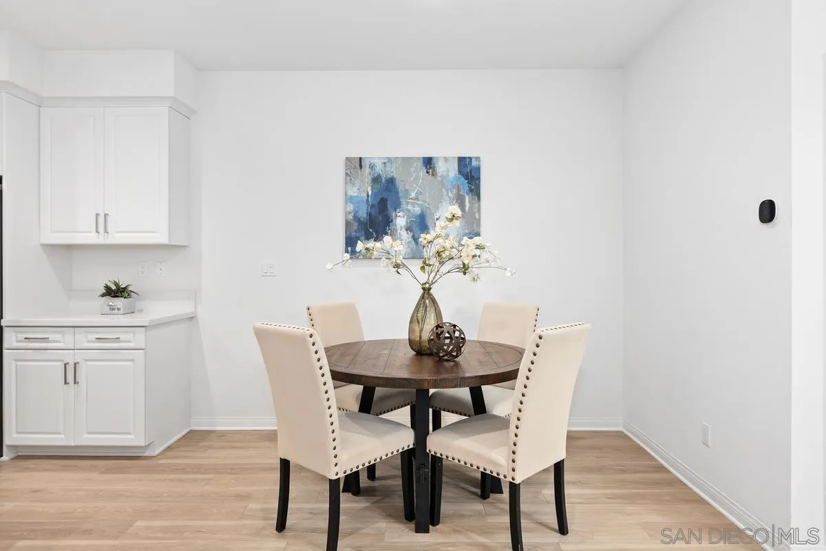 10149 Graphite Street Spring Valley, CA 91977 - Photo 8 of 22 a dining room with furniture and window