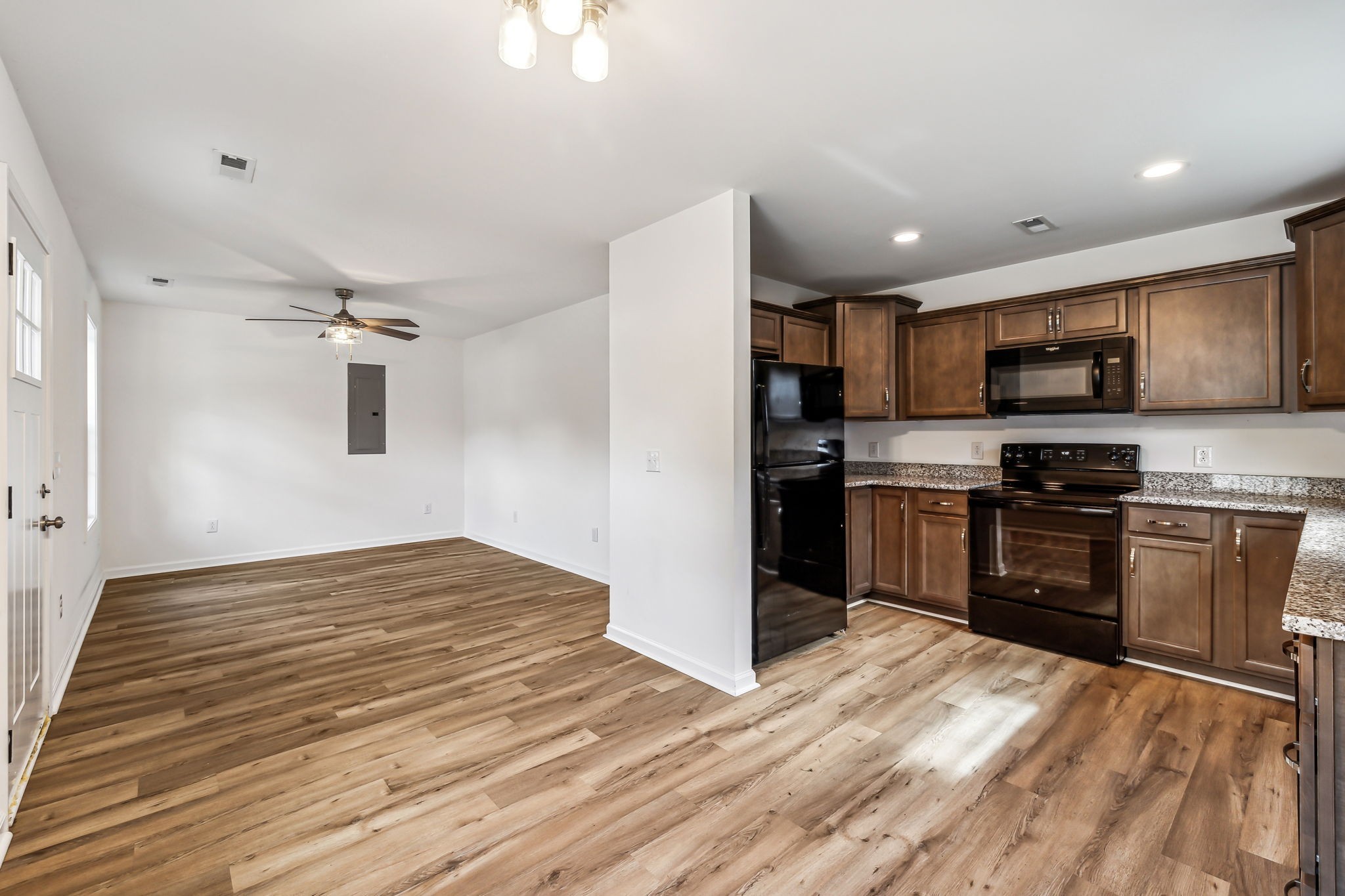 1816 Cunningham Ridge Clarksville, TN 37040 - Photo 11 of 32 a kitchen with granite countertop a refrigerator stove top oven and sink