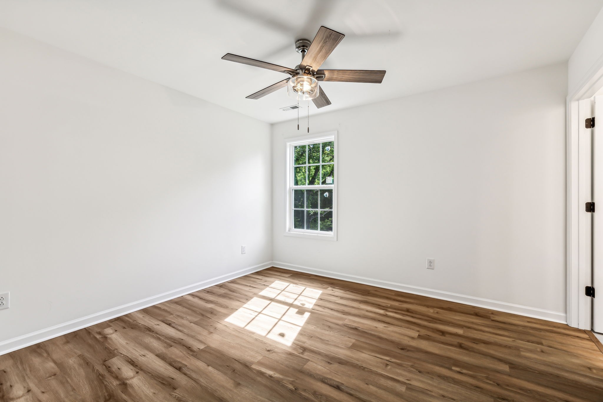 1816 Cunningham Ridge Clarksville, TN 37040 - Photo 16 of 32 a view of empty room with wooden floor and fan
