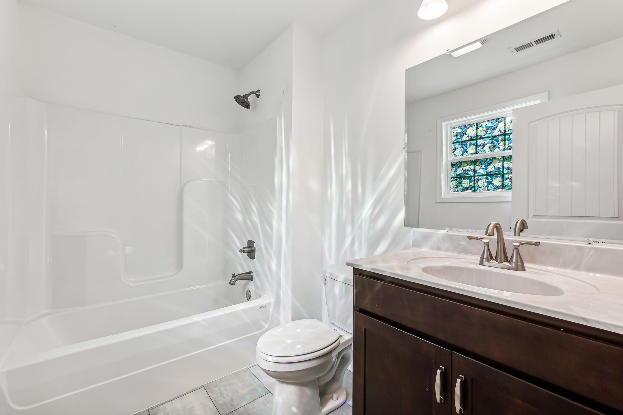 1816 Cunningham Ridge Clarksville, TN 37040 - Photo 20 of 32 a bathroom with a granite countertop sink toilet and shower