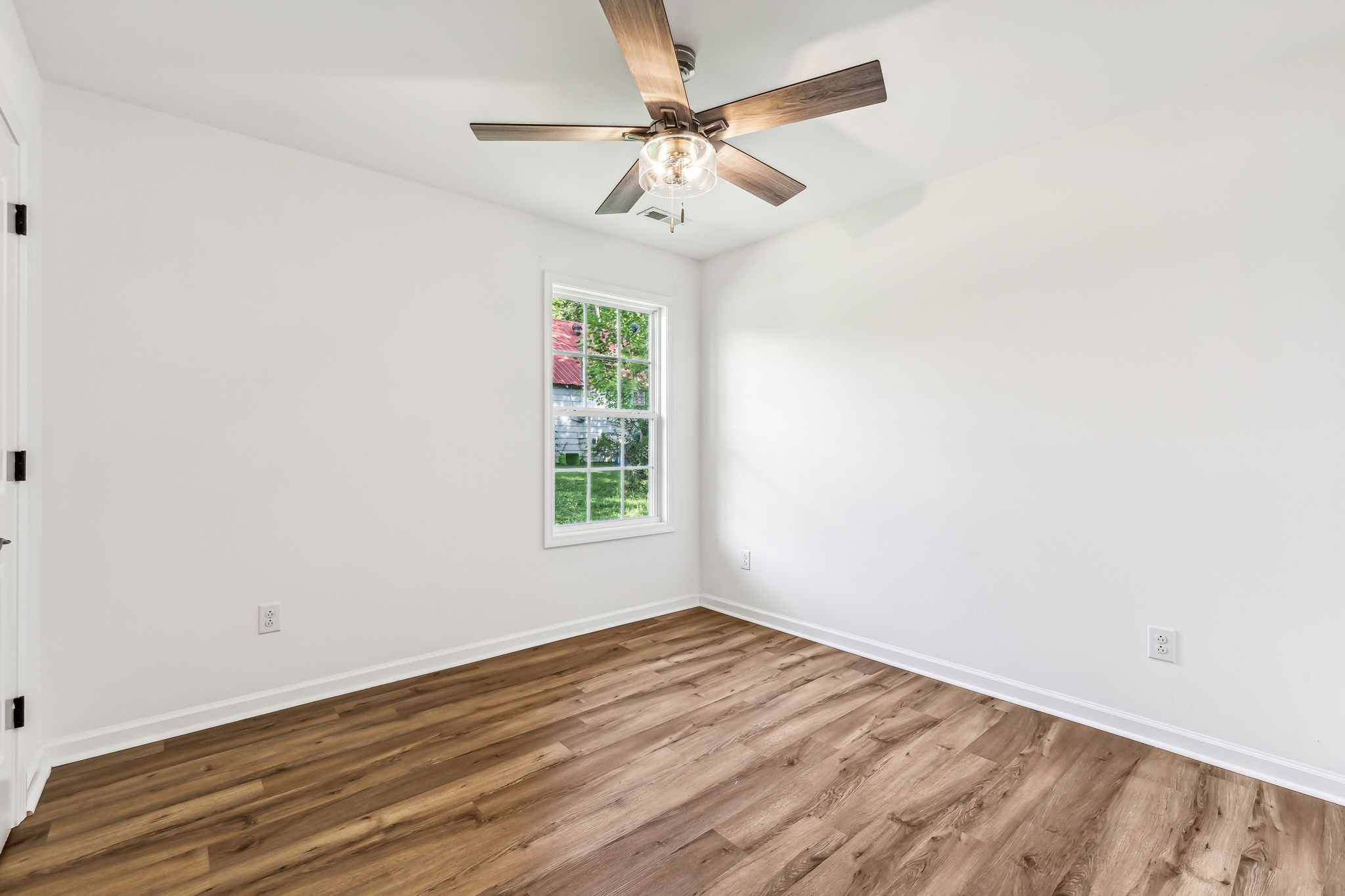 1816 Cunningham Ridge Clarksville, TN 37040 - Photo 21 of 32 an empty room with a window and a fan