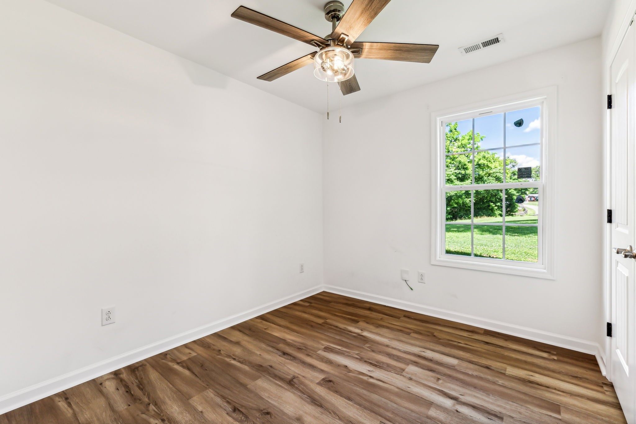 1816 Cunningham Ridge Clarksville, TN 37040 - Photo 24 of 32 an empty room with a window and a fan