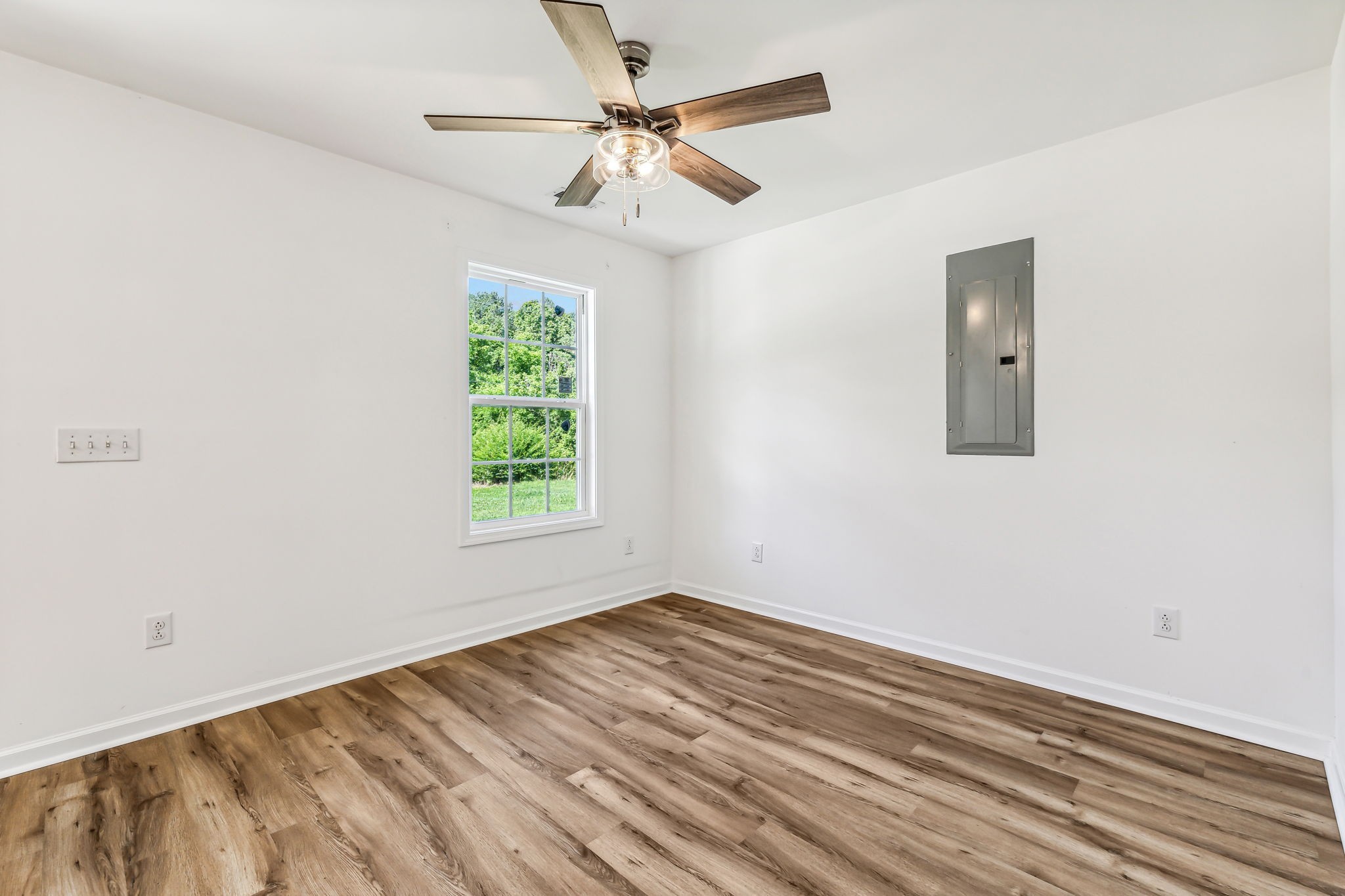 1816 Cunningham Ridge Clarksville, TN 37040 - Photo 7 of 32 an empty room with a window and a ceiling fan