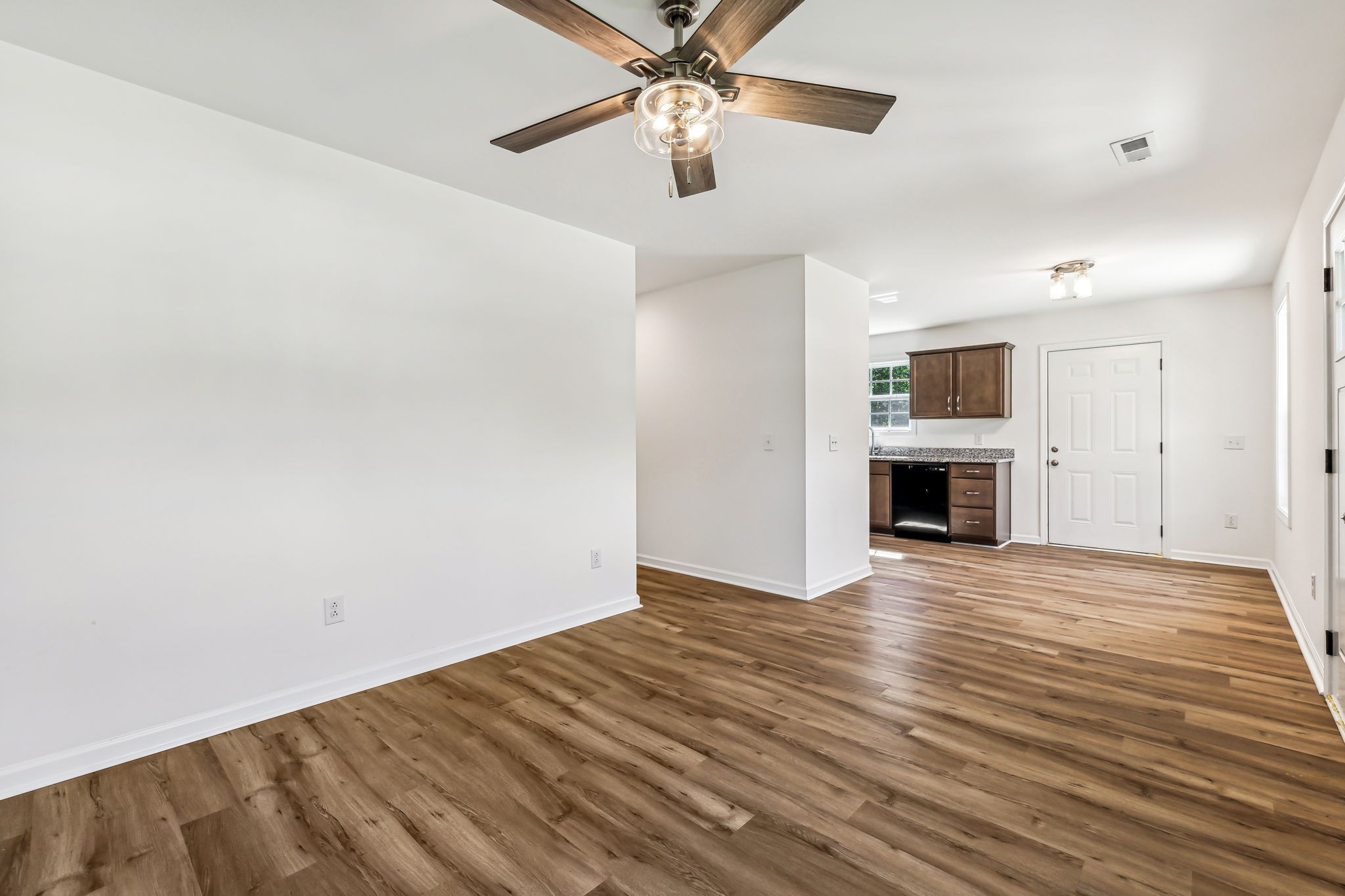 1816 Cunningham Ridge Clarksville, TN 37040 - Photo 9 of 32 a view of empty room with wooden floor and ceiling fan