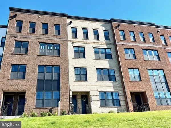 a large building with a yard in front