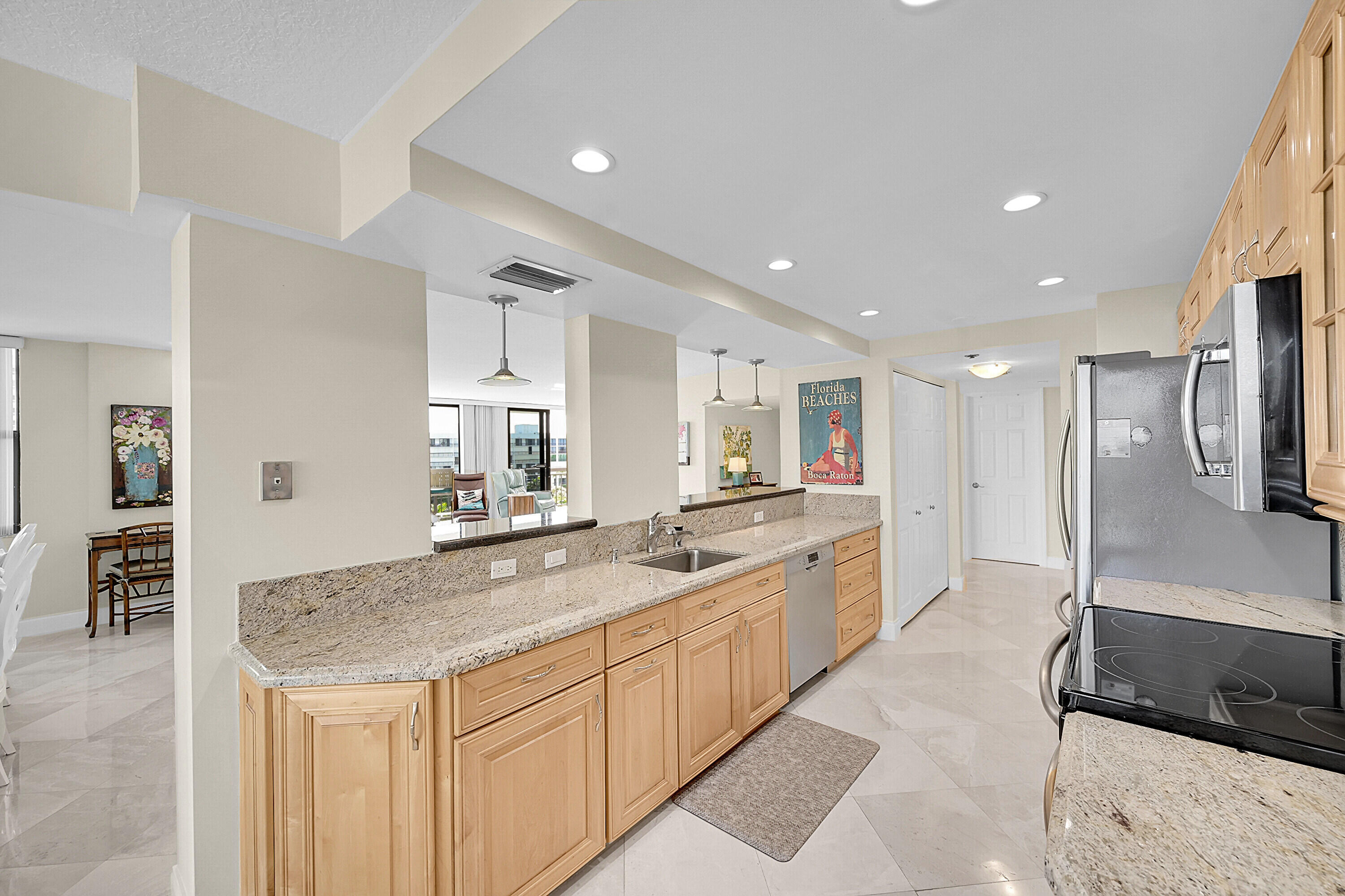 2003 North Ocean Boulevard, Unit 802 Boca Raton, FL 33431 - Photo 15 of 30 Kitchen with Open View to Family Room