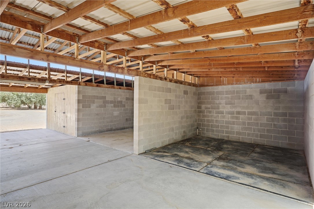 1531 West Harris Farm Road Pahrump, NV 89060 - Photo 13 of 37 Secure, versatile storage structures with concrete flooring and robust block construction.