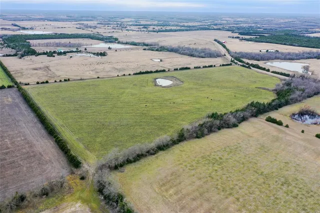 an aerial view of beach and ocean