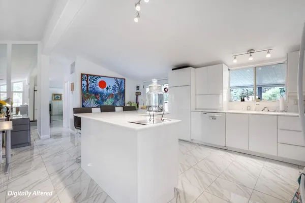 a kitchen with counter top space and appliances