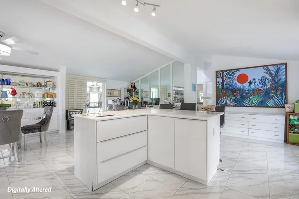 a kitchen with cabinets and window