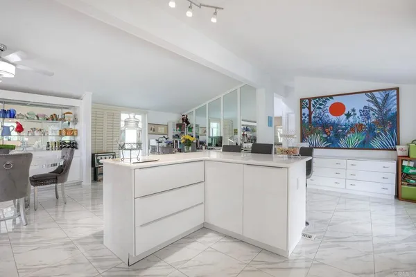 a kitchen with cabinets and window