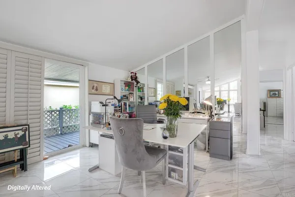 a dining room with furniture and wooden floor